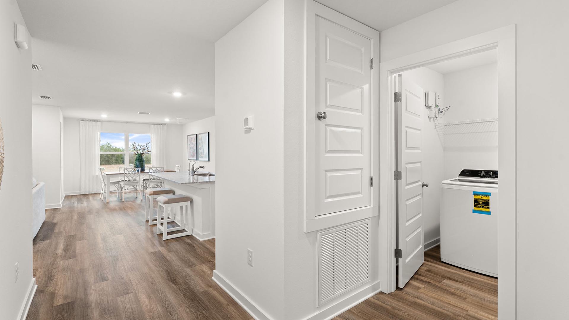 There is a laundry area off the hall leading to the main living room