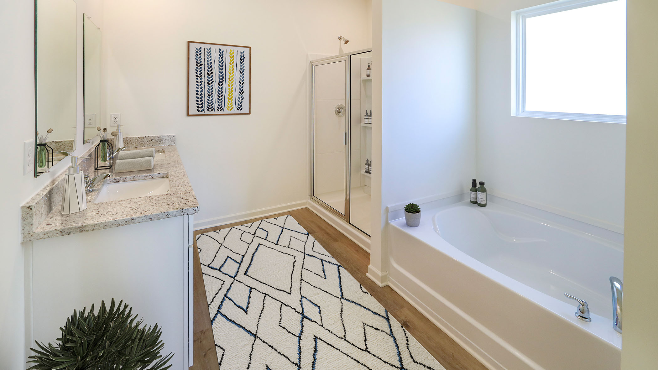 The primary bathroom has a separate shower and soak tub