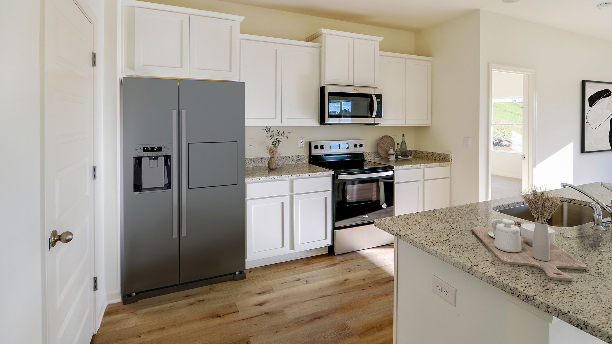 The kitchen has appliances that include a stove microwave and dishwasher