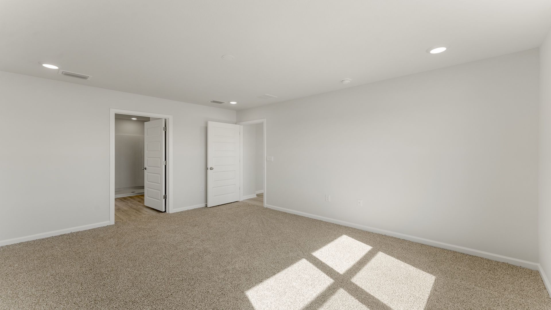 The primary bedroom has an ensuite bathroom