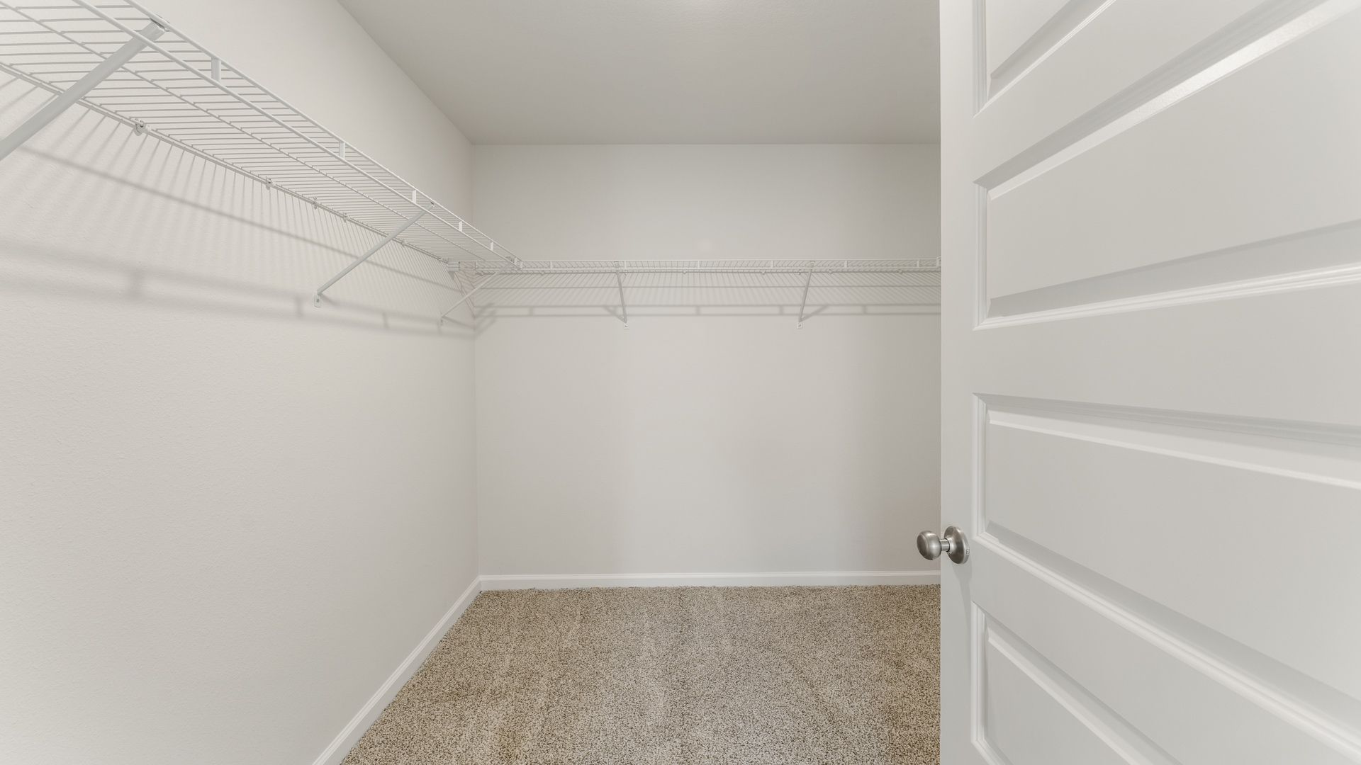 Walk-in closet in the primary bathroom