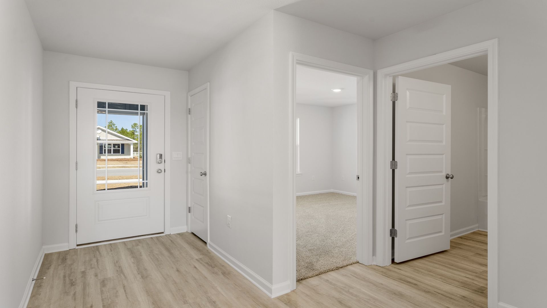 Entry to the home with EVP flooring in the hall to living area