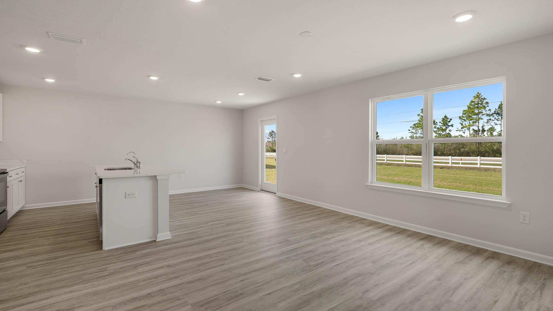 There are windows along the back of the living area that allow natural light to flood in