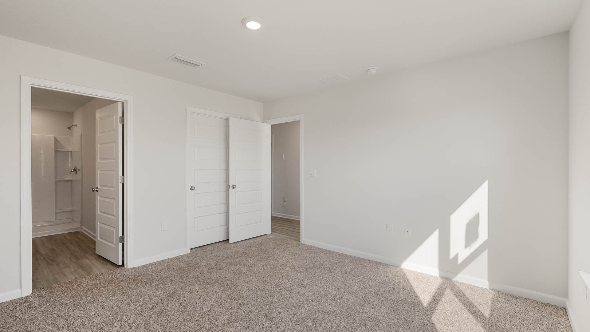 The primary bedroom has an ensuite bathroom