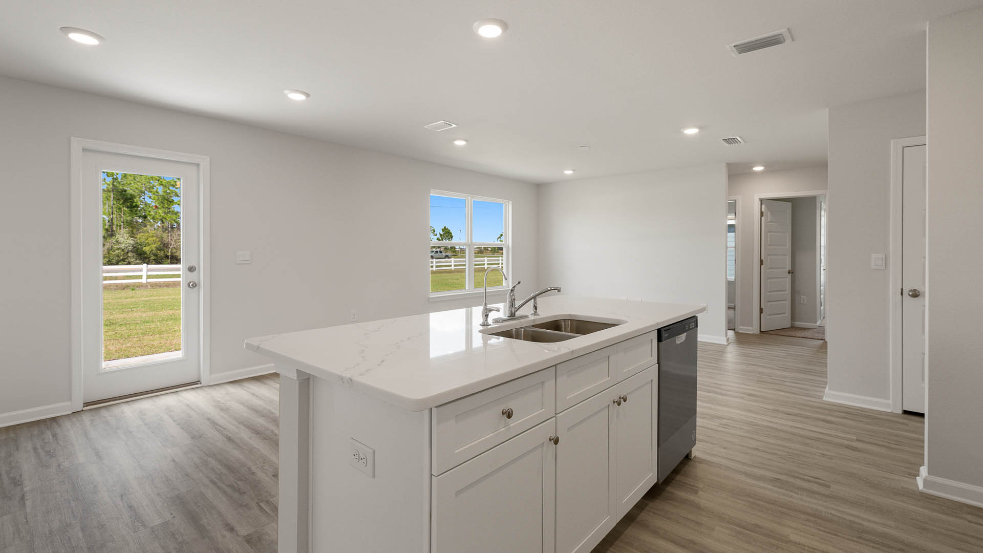 The island holds the sink and dishwasher for easy meal prep, service and cleanup