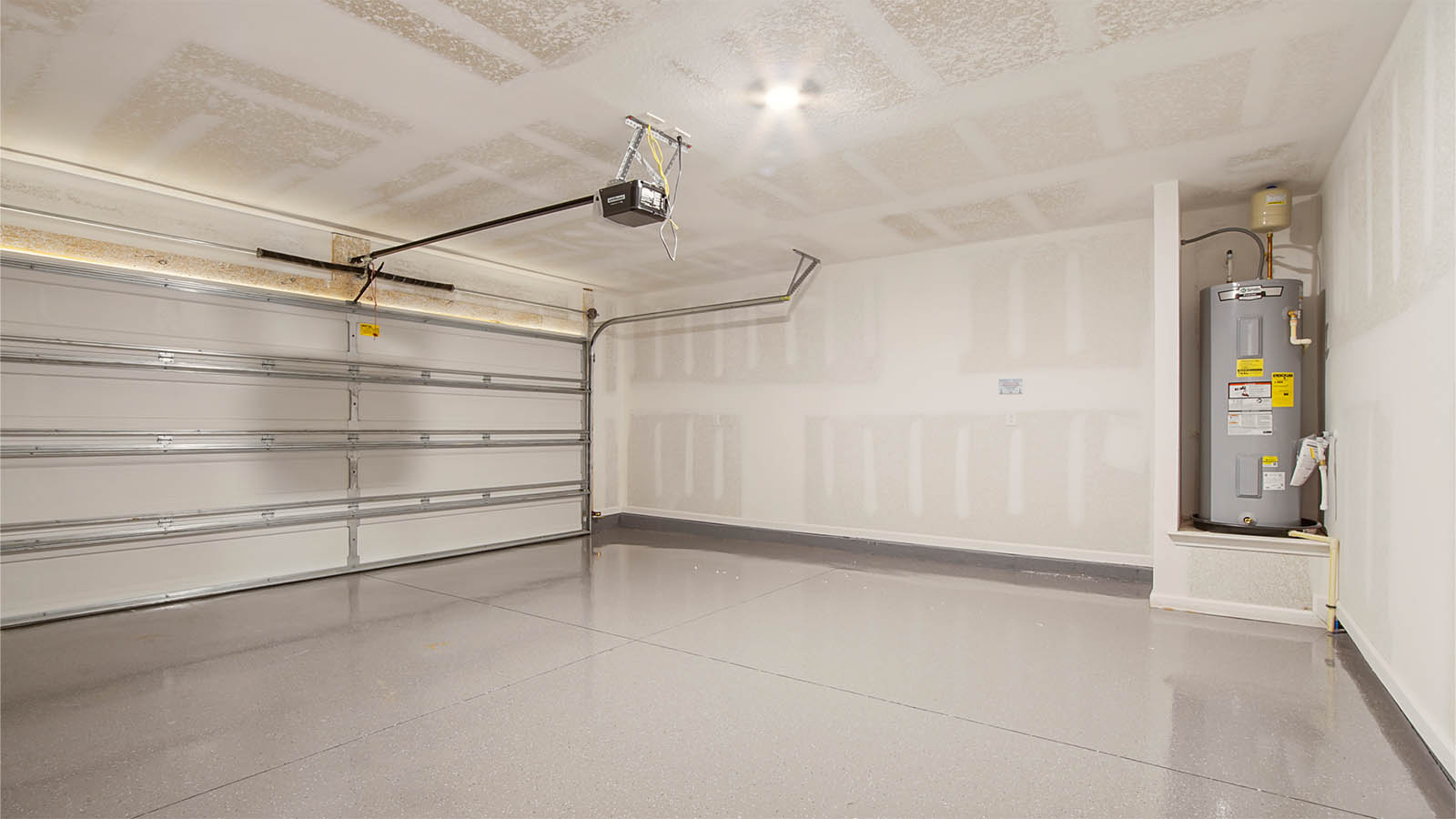 The garage is located off the front entry hall and has space for two cars