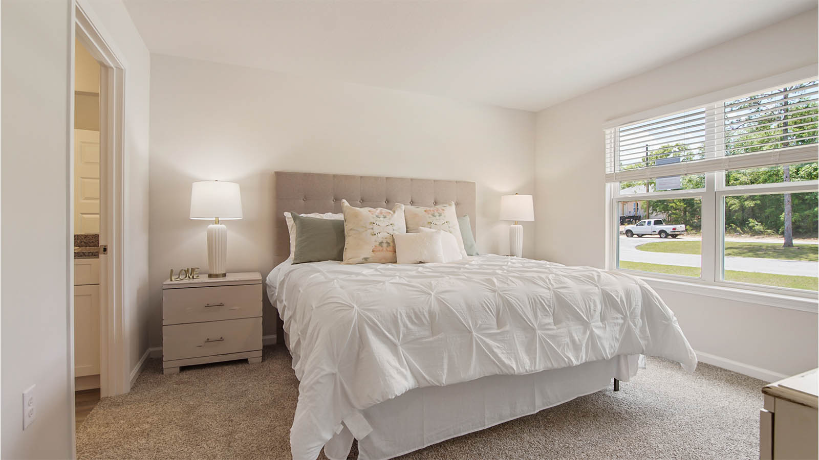 The primary bedroom is located off the front entry hall