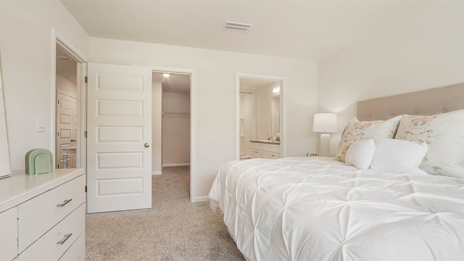 The primary bedroom has a closet and private ensuite bathroom