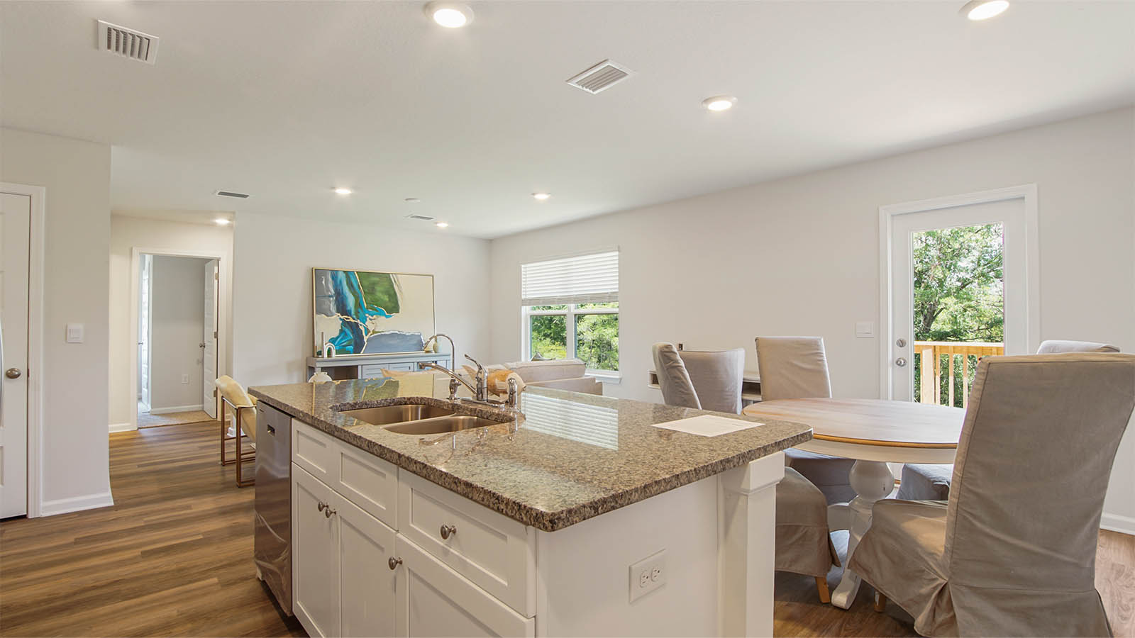 The kitchen is adjacent to the dining area and opens to the living space