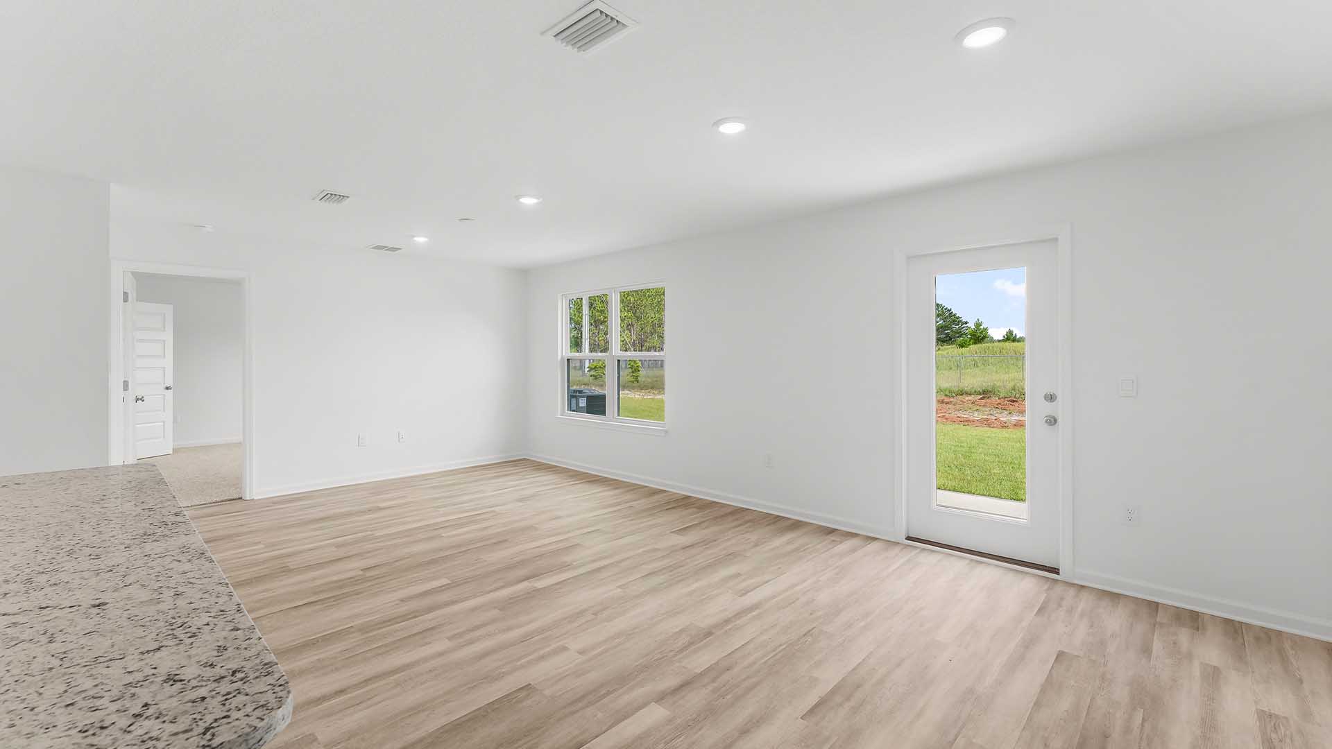 The primary bedroom is accessible from the living room