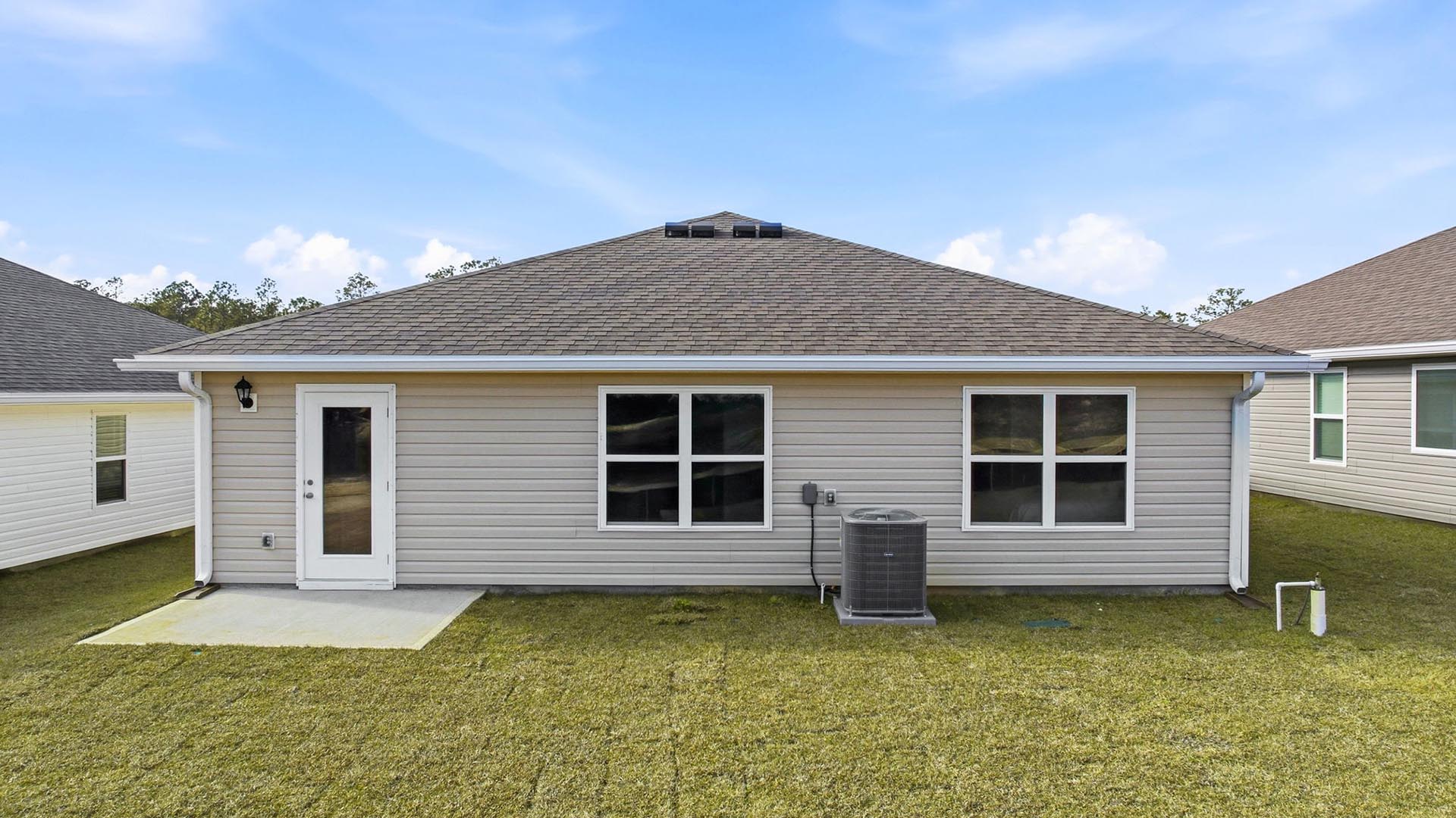There is an open patio at the back of the home