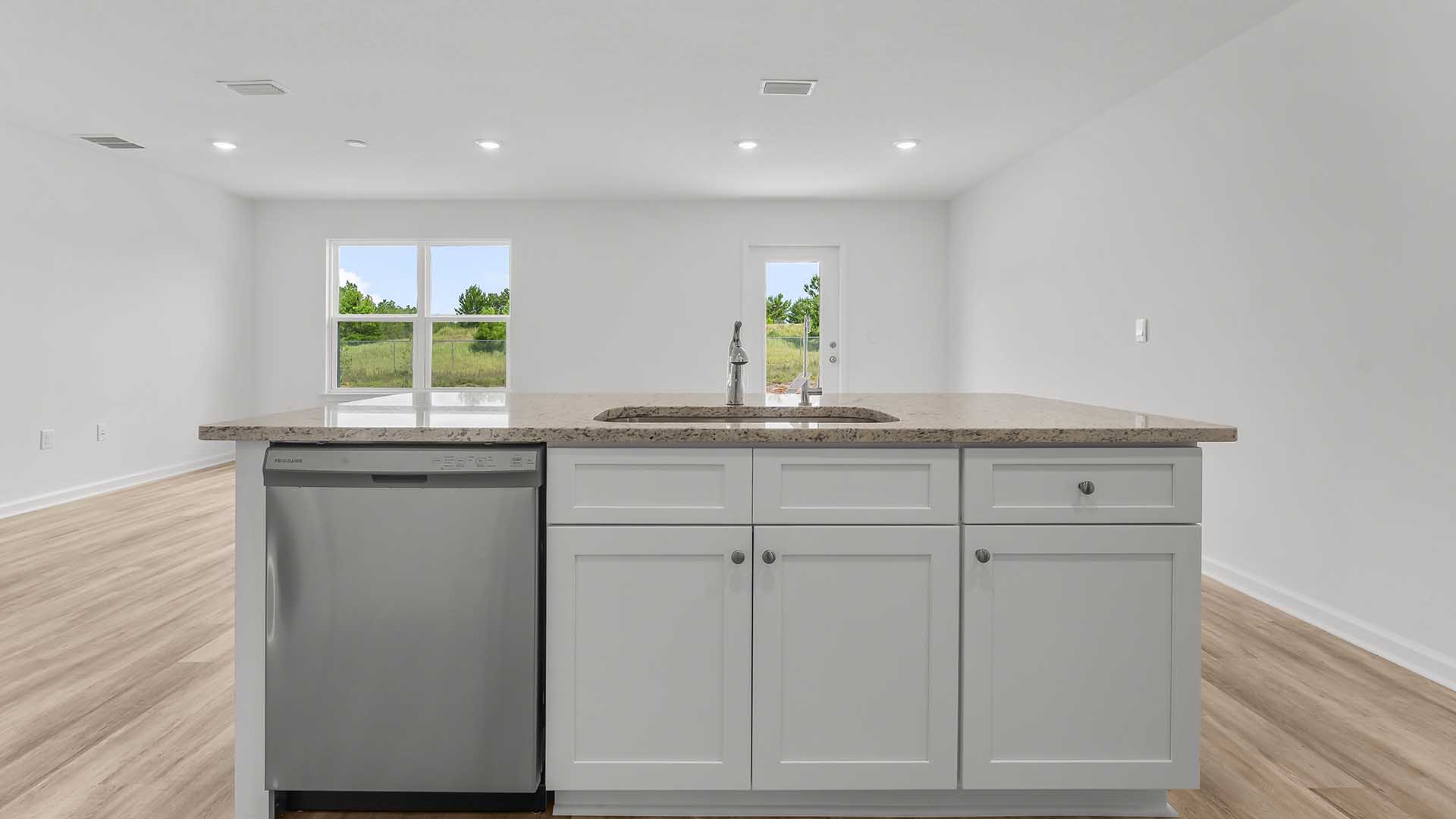 The kitchen looks out to the dining area
