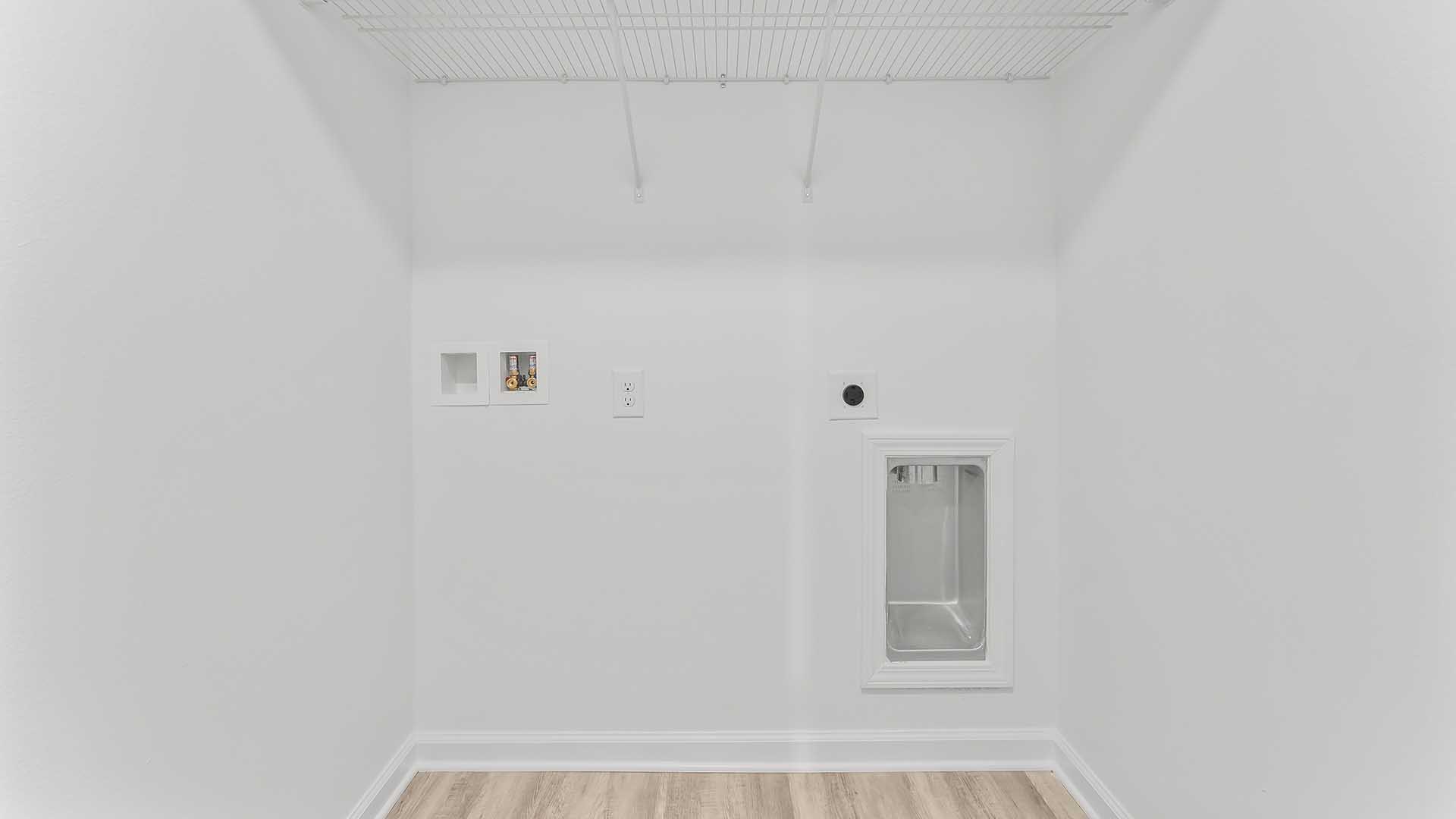 The laundry room has space for a full size washer and dryer