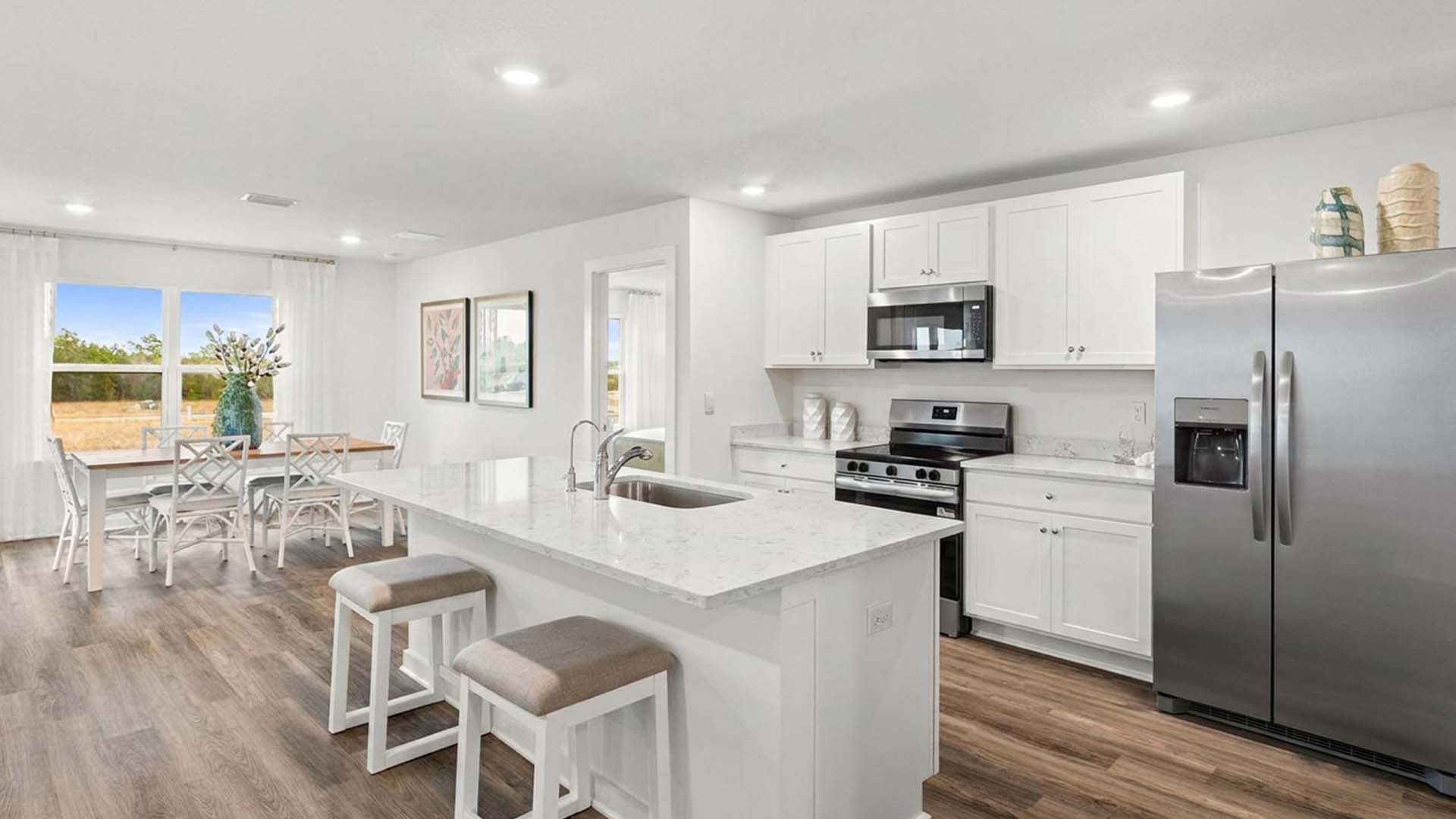 The kitchen is open to the living and dining areas