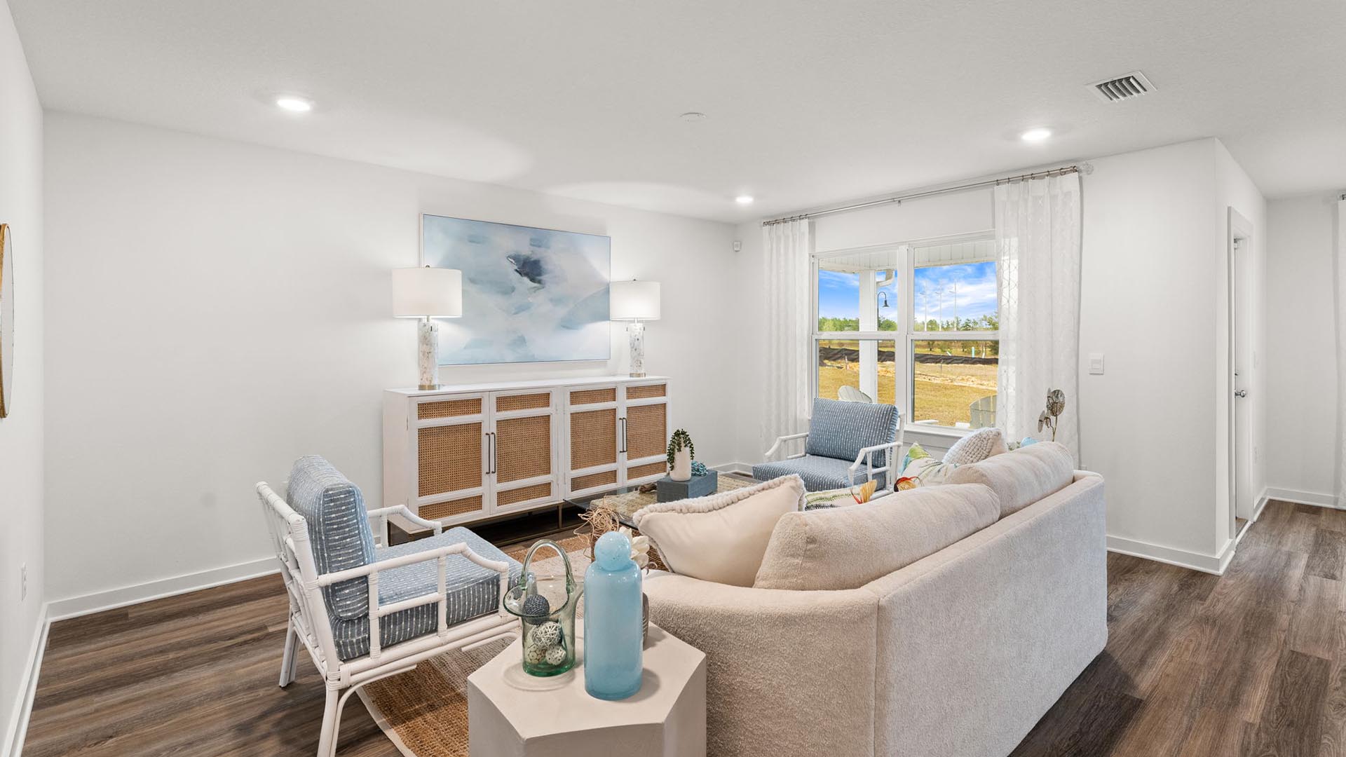 The spacious living area has EVP flooring and offers a comfortable space for family or guests