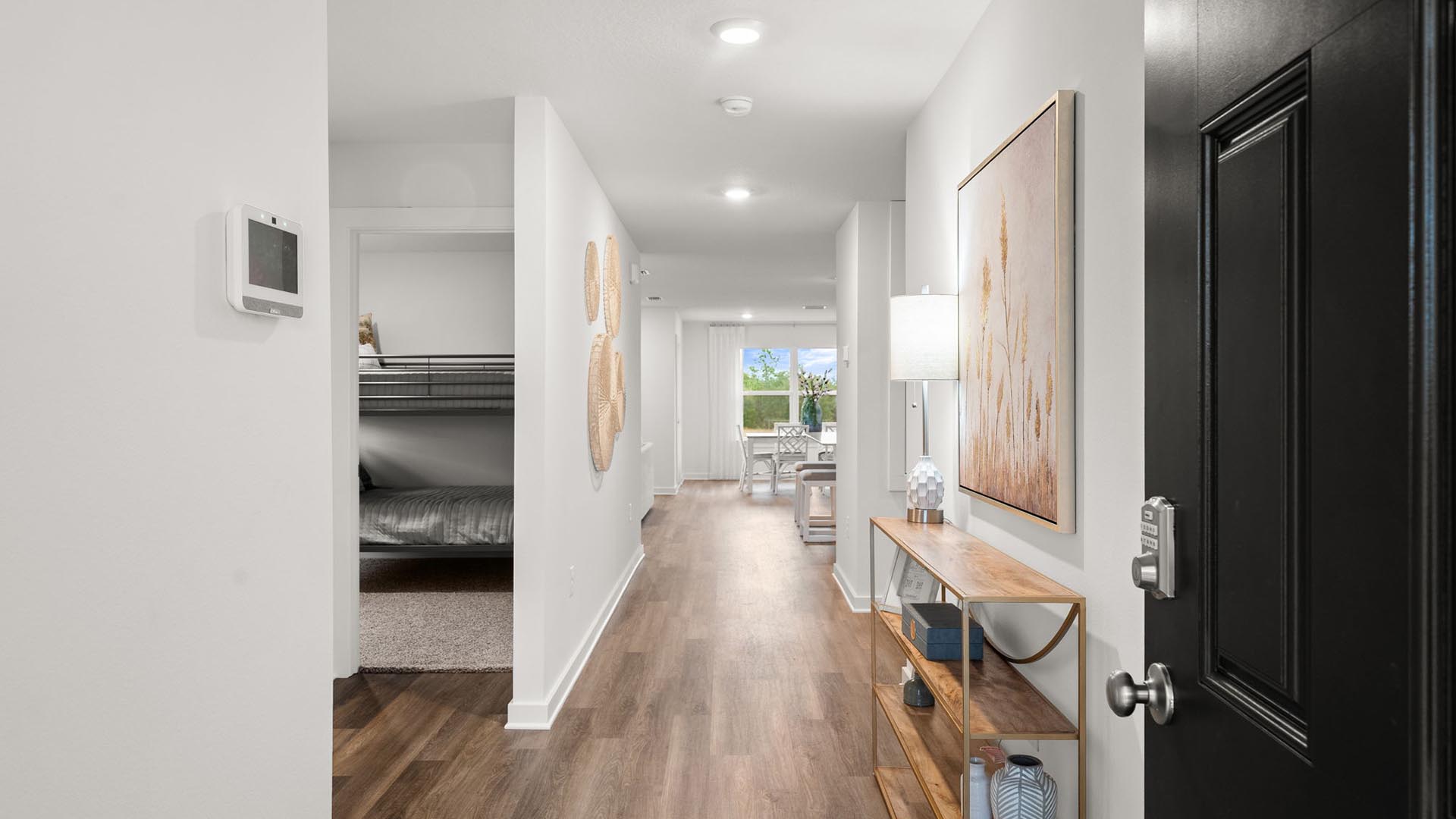 The Aria features an entry hall with EVP flooring leading to the open living area
