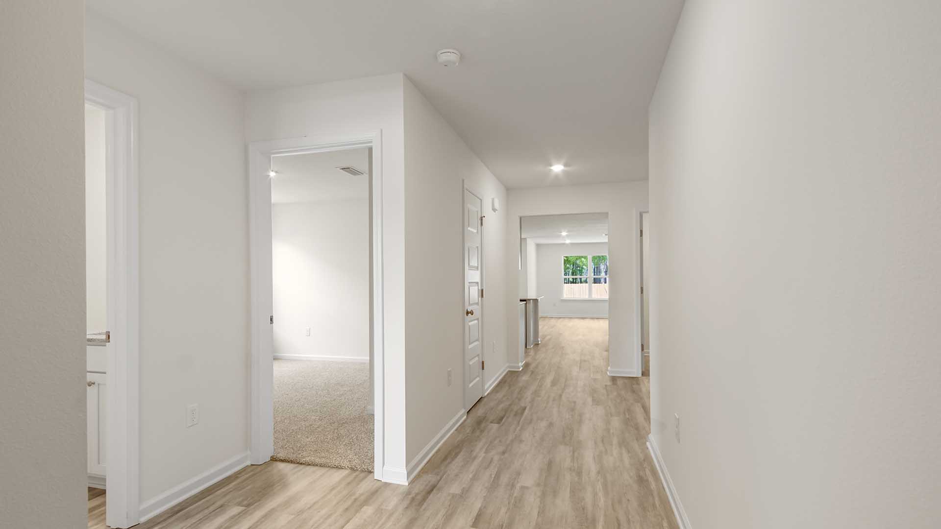Entry to the home with EVP flooring in the hall to living area
