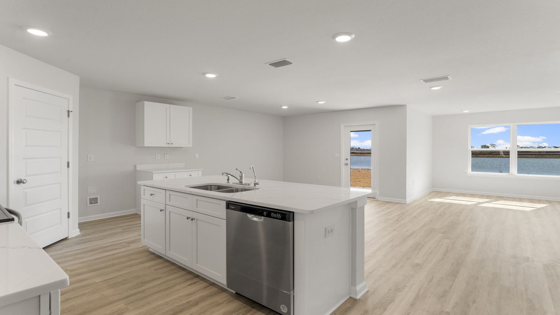 The kitchen is open to living and dining areas