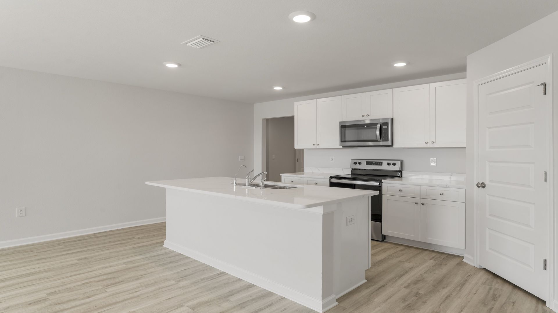 The kitchen has an appliance package including a stove microwave and dishwasher