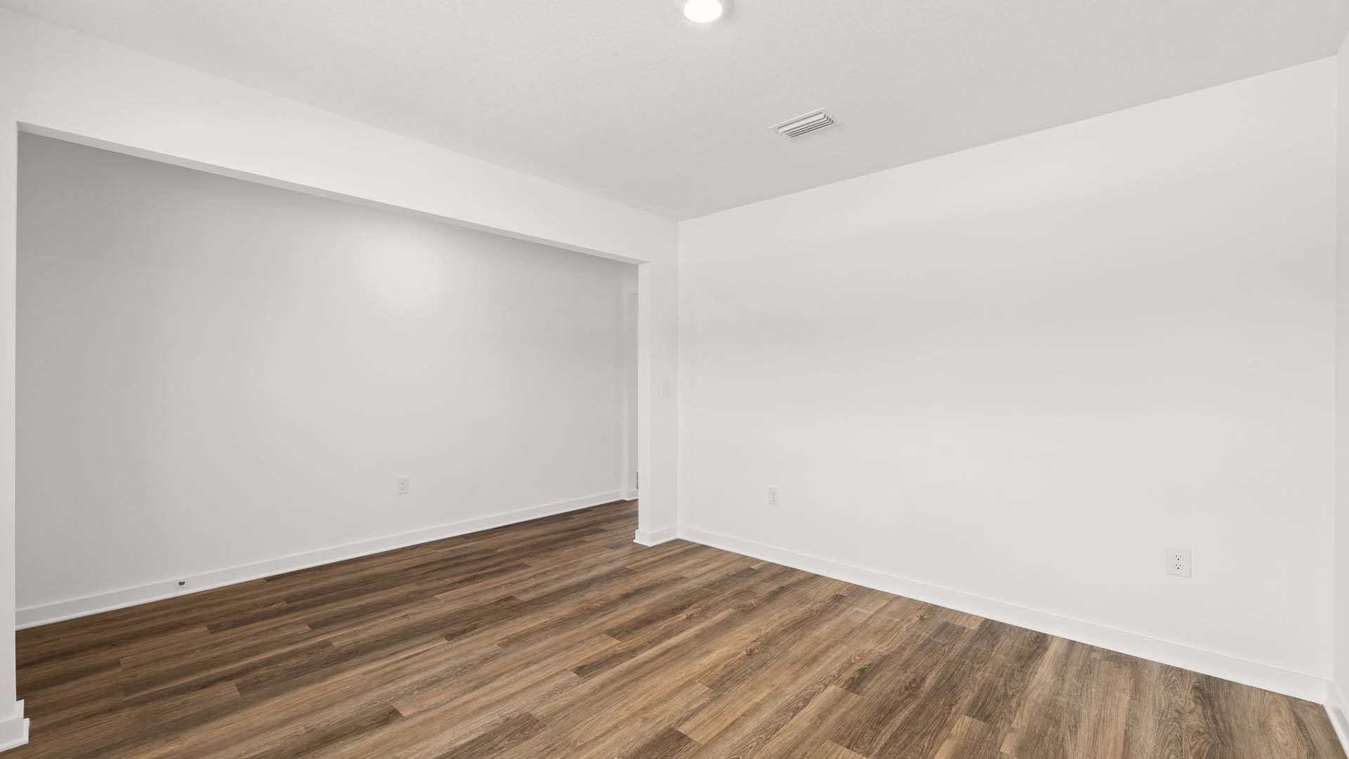 The flex space is brightly lit with natural light from the picture window