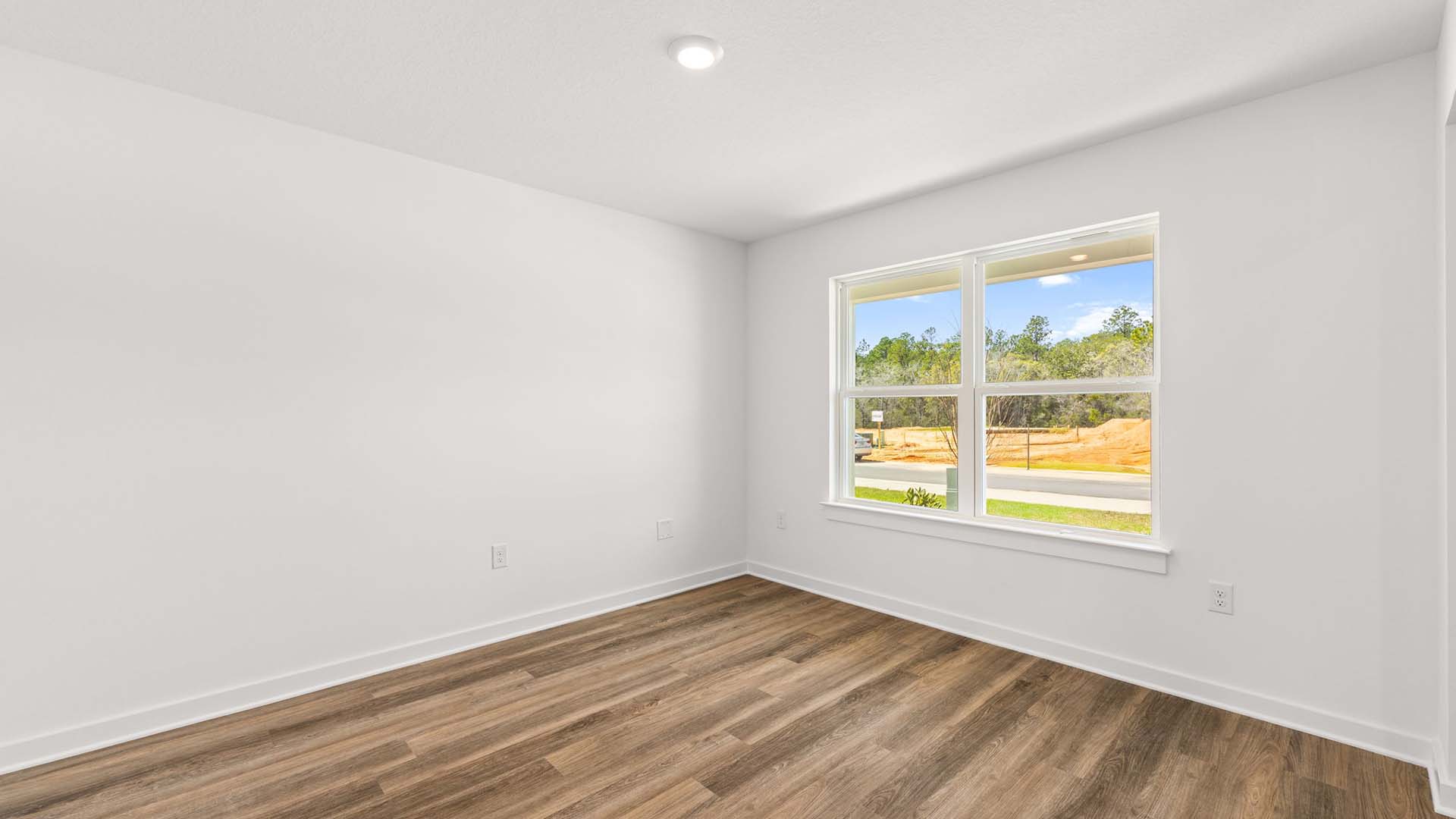 EVP flooring brightens the flex space and natural light floods in