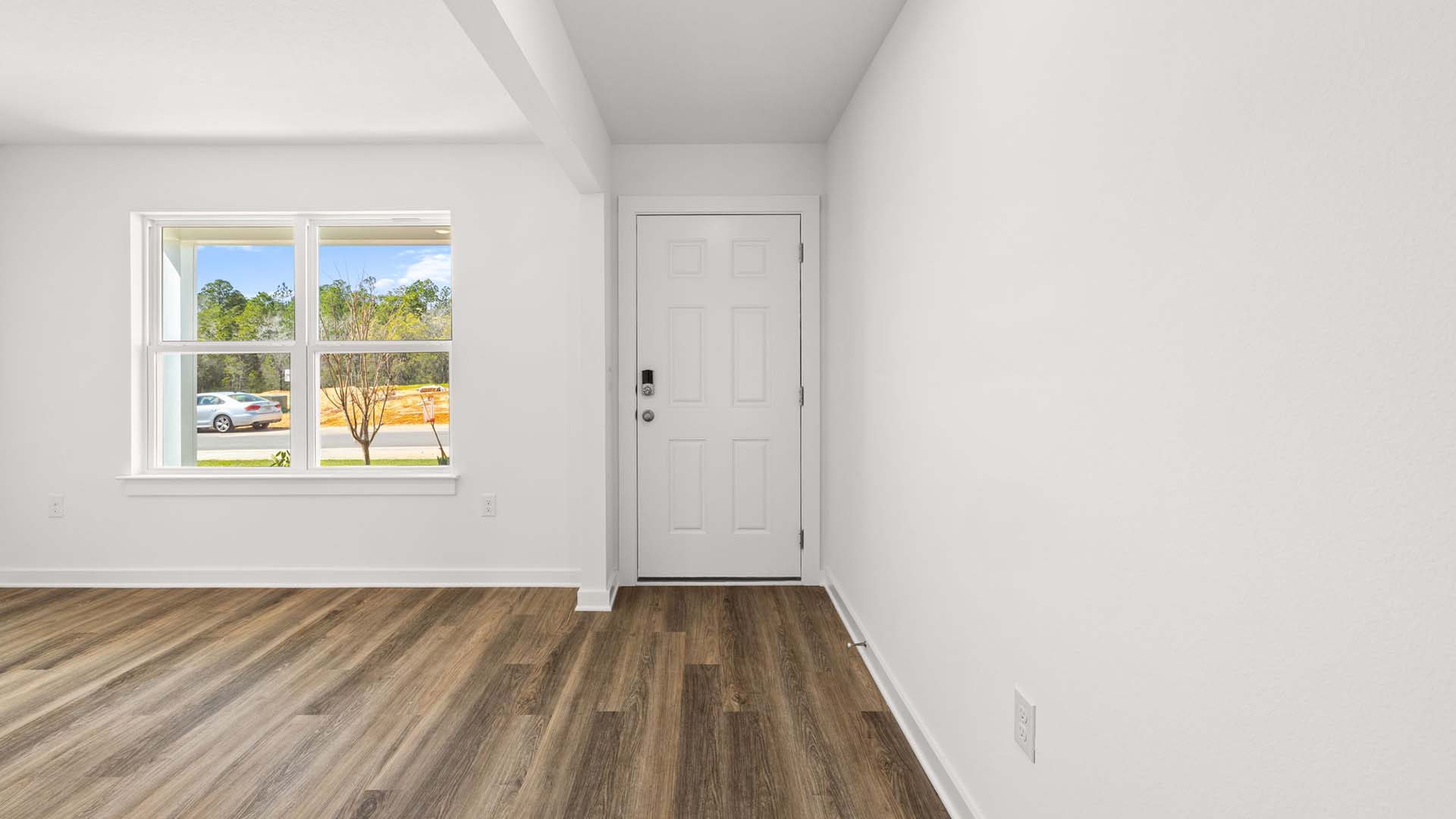 Open flex space off the entry hall provides room for a formal sitting room or dining room