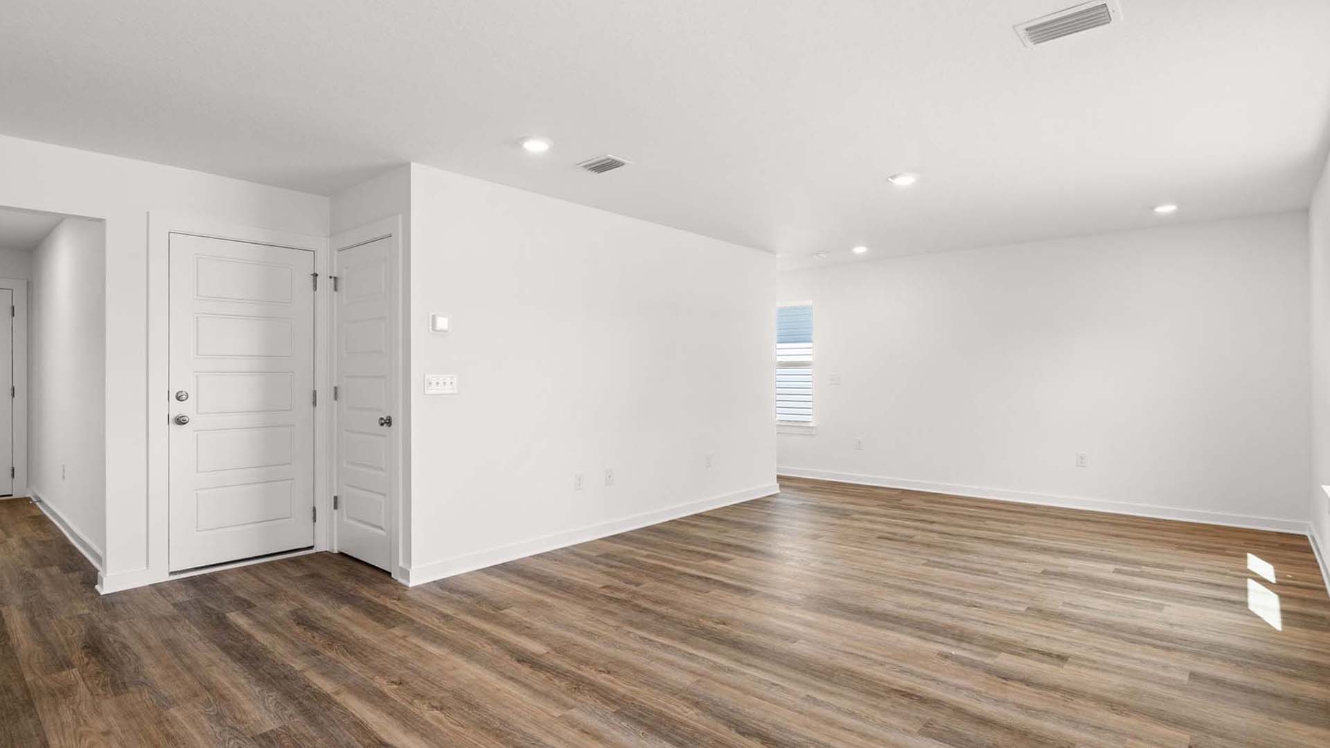 The open living space can hold a casual dining area and living room suite