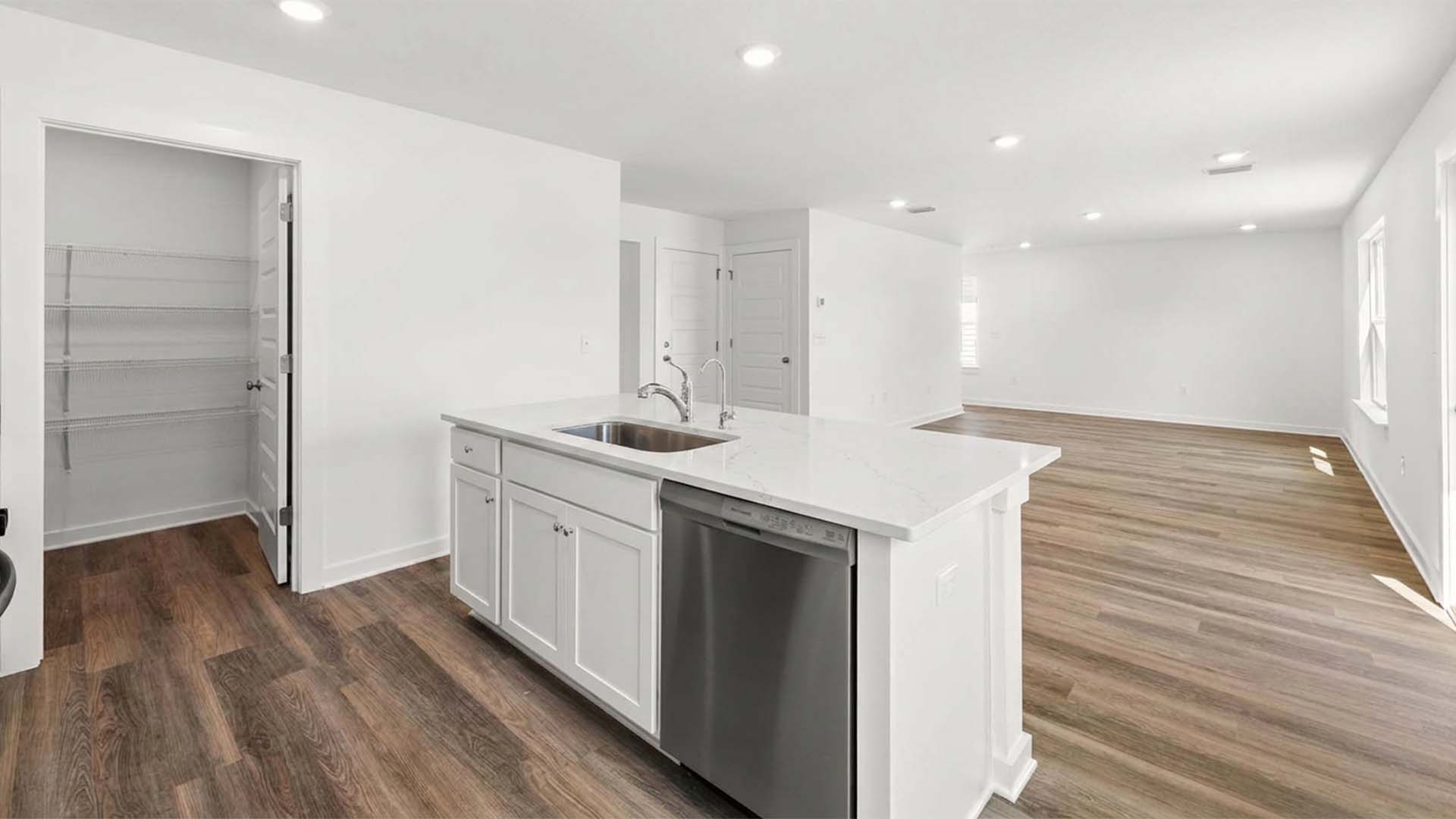 The kitchen looks out to the open great room
