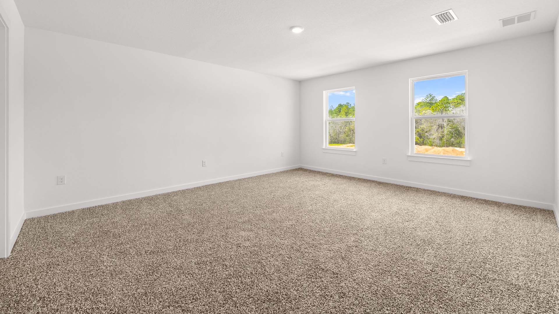 The primary bedroom has carpet and is on the second level
