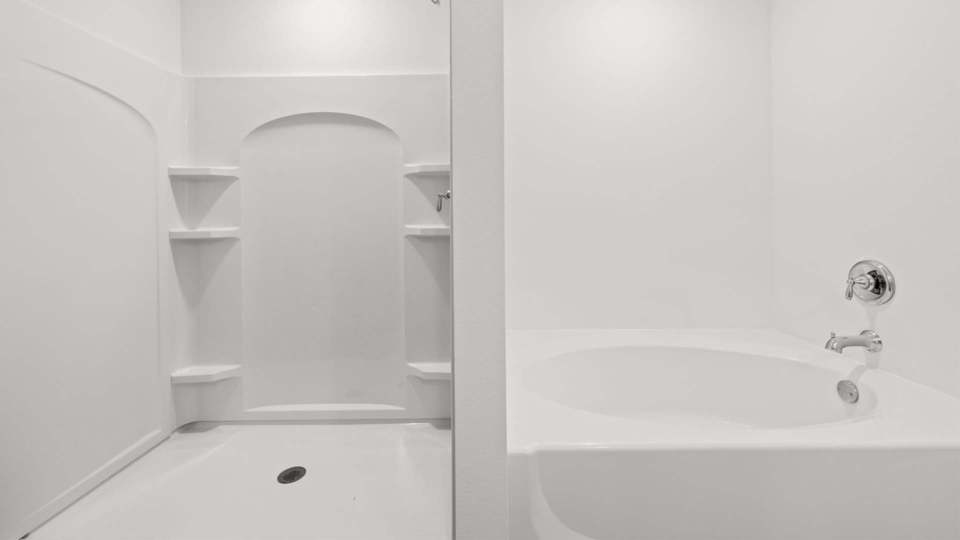 The primary bathroom has a separate shower and soak tub