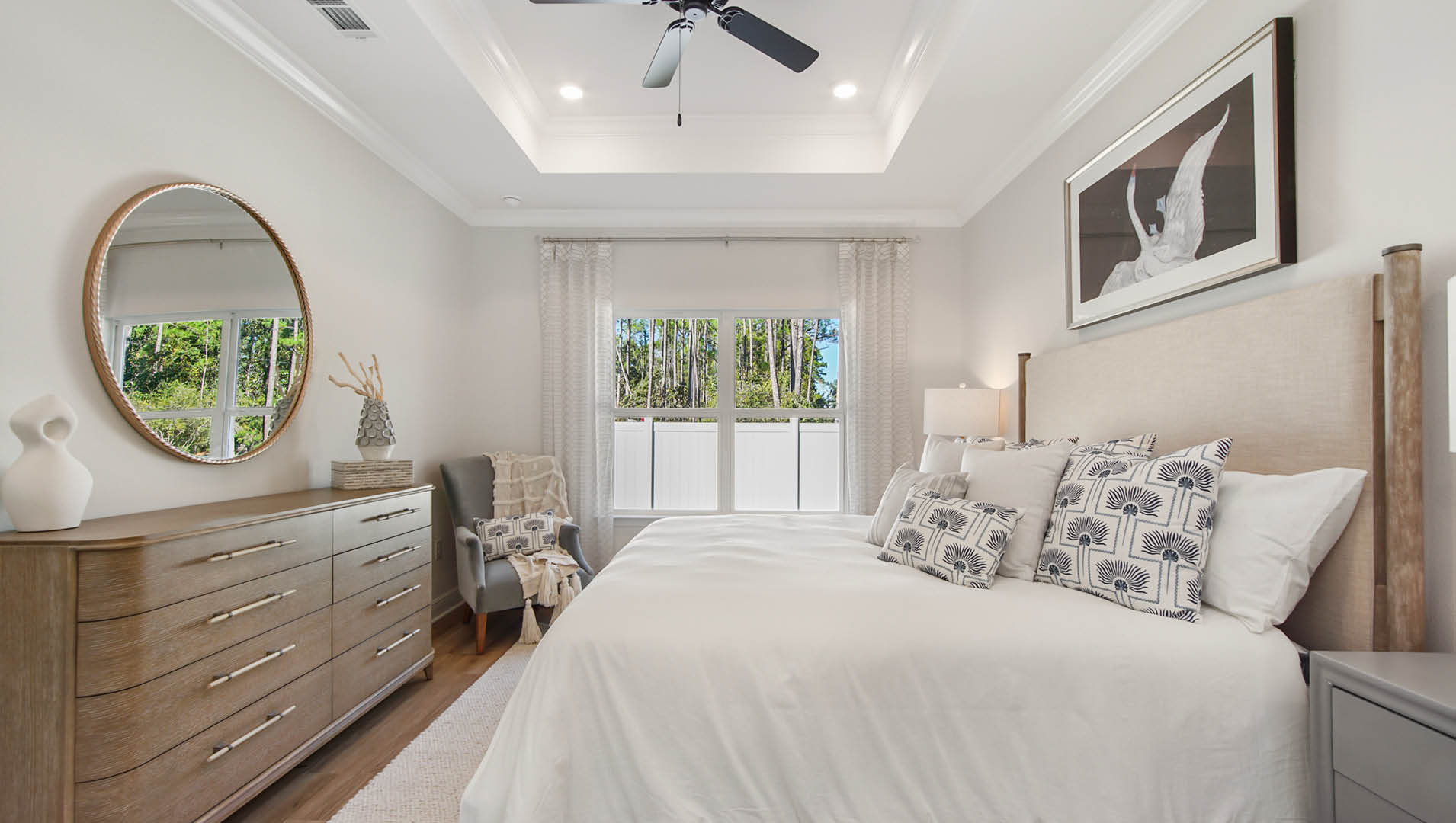 The Primary bedroom is located at the rear of the home and features a private ensuite bath