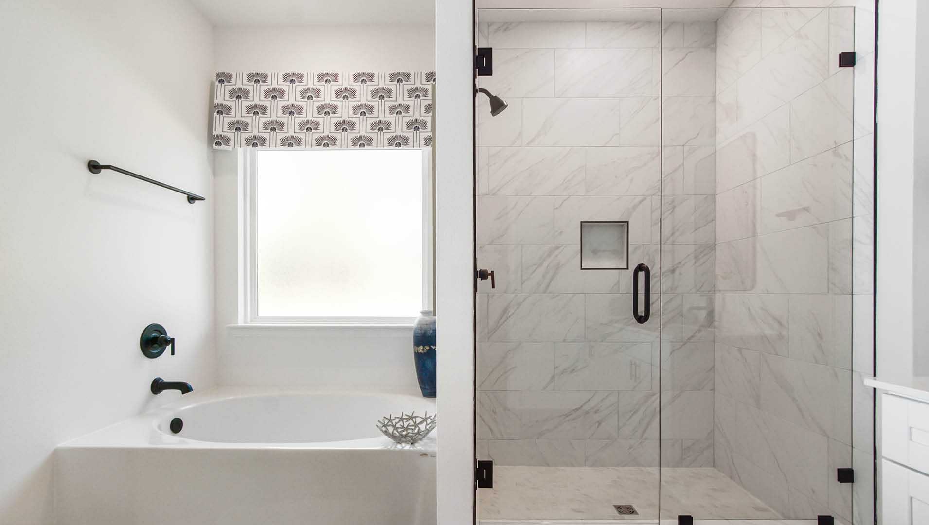 The separate shower and tub offer a spa like retreat and the shower has been elegantly designed with tile and a glass enclosure