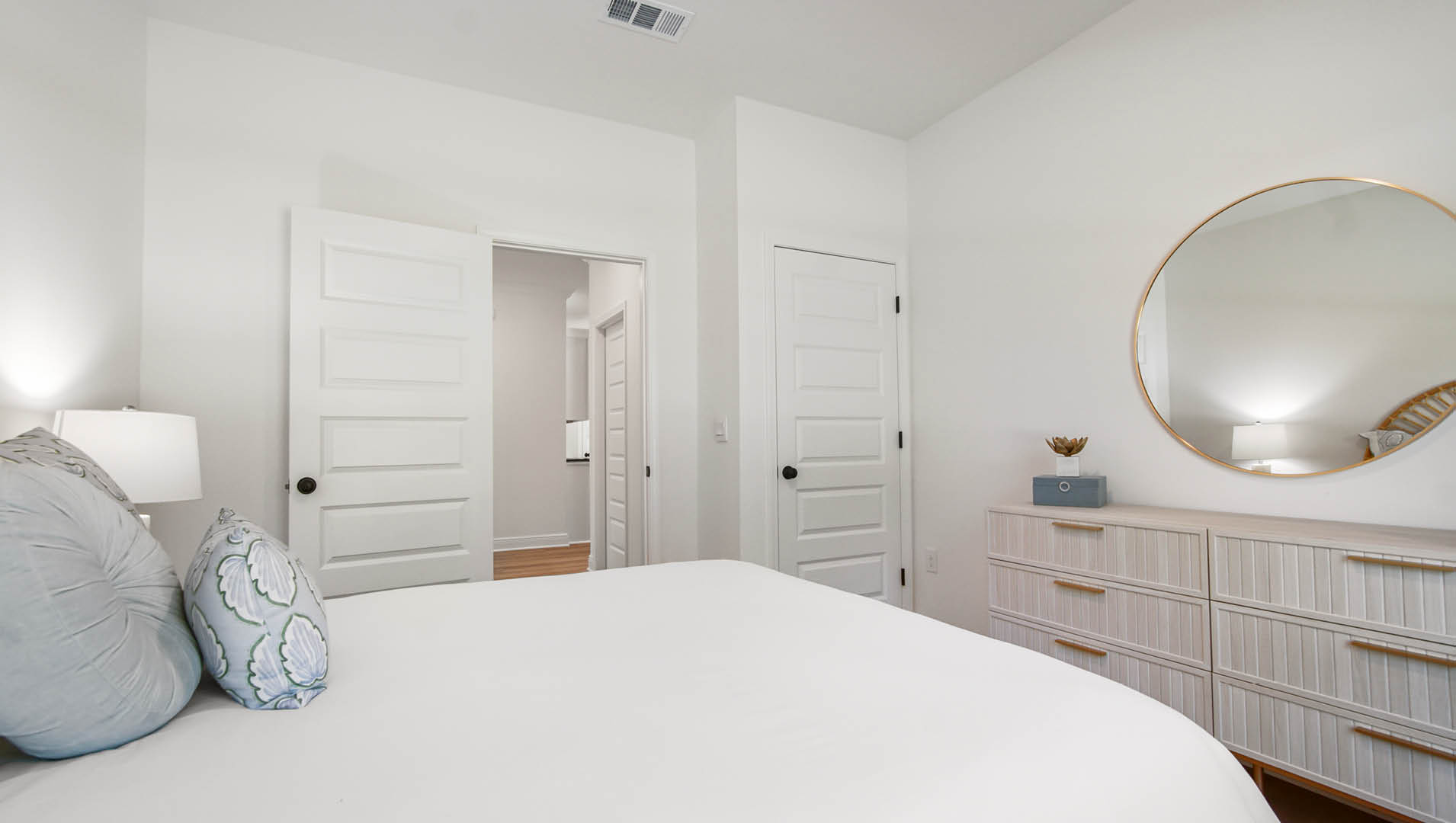 The fourth bedroom has a private feel with its hallway