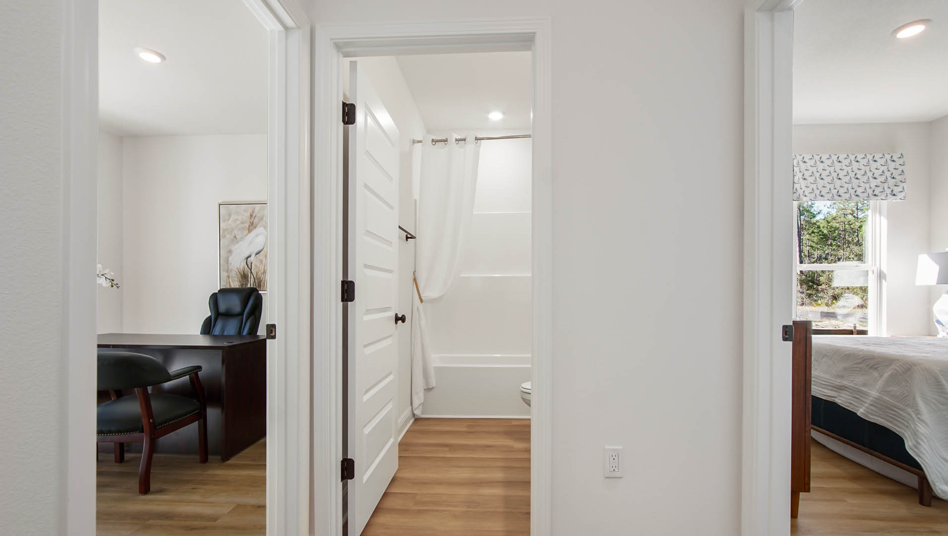 The Rhett has a shared bathroom and two additional bedrooms off the front foyer