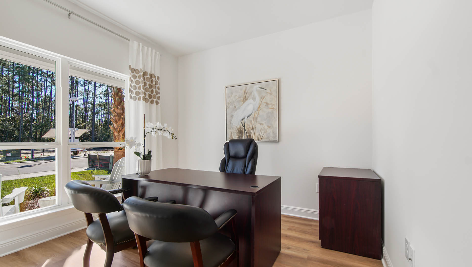 Bedroom two features EVP flooring and expansive windows allowing for natural light