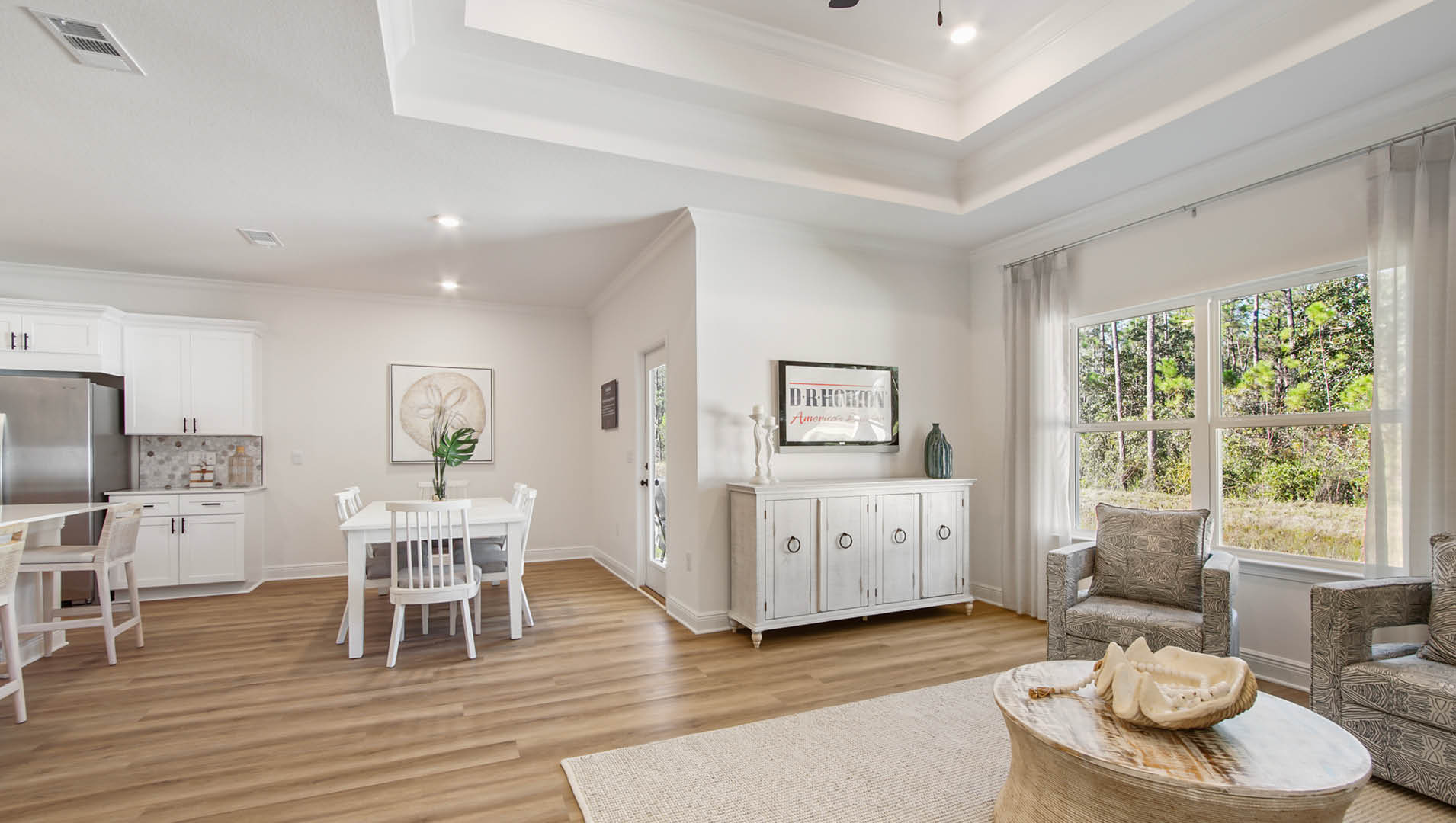 The spacious living area is tucked off the dining area that has access to the covered back patio