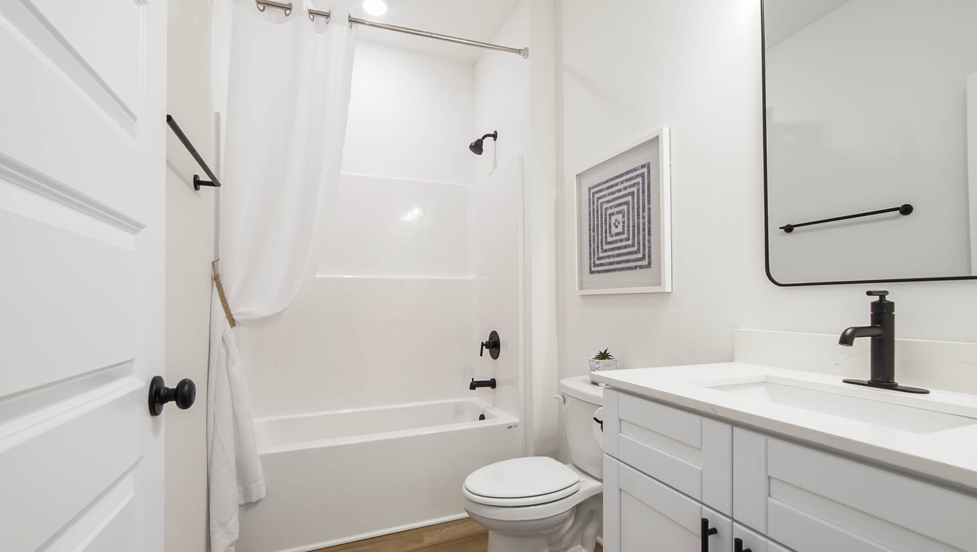 Shared hall bathroom between bedrooms two and three