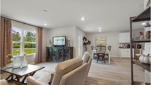 Living room adorned with windows allowing for natural light