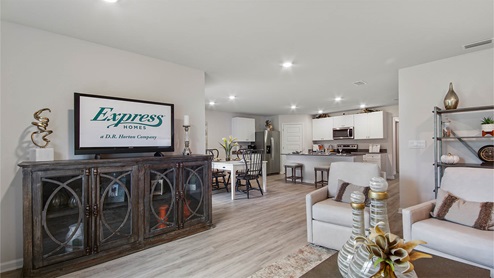 The living room is spacious and is open to the kitchen