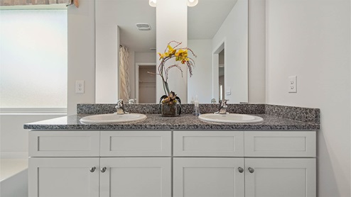 Vanity with mirrors and cabinetry