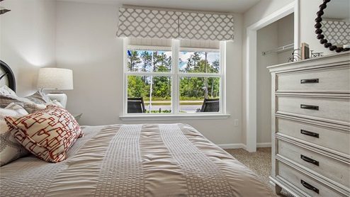 Bedroom two features a spacious closet and plush carpet