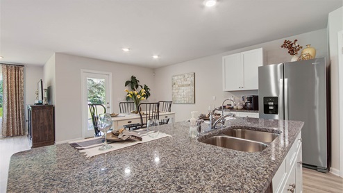 Large center island with space for meal prep and cleanup