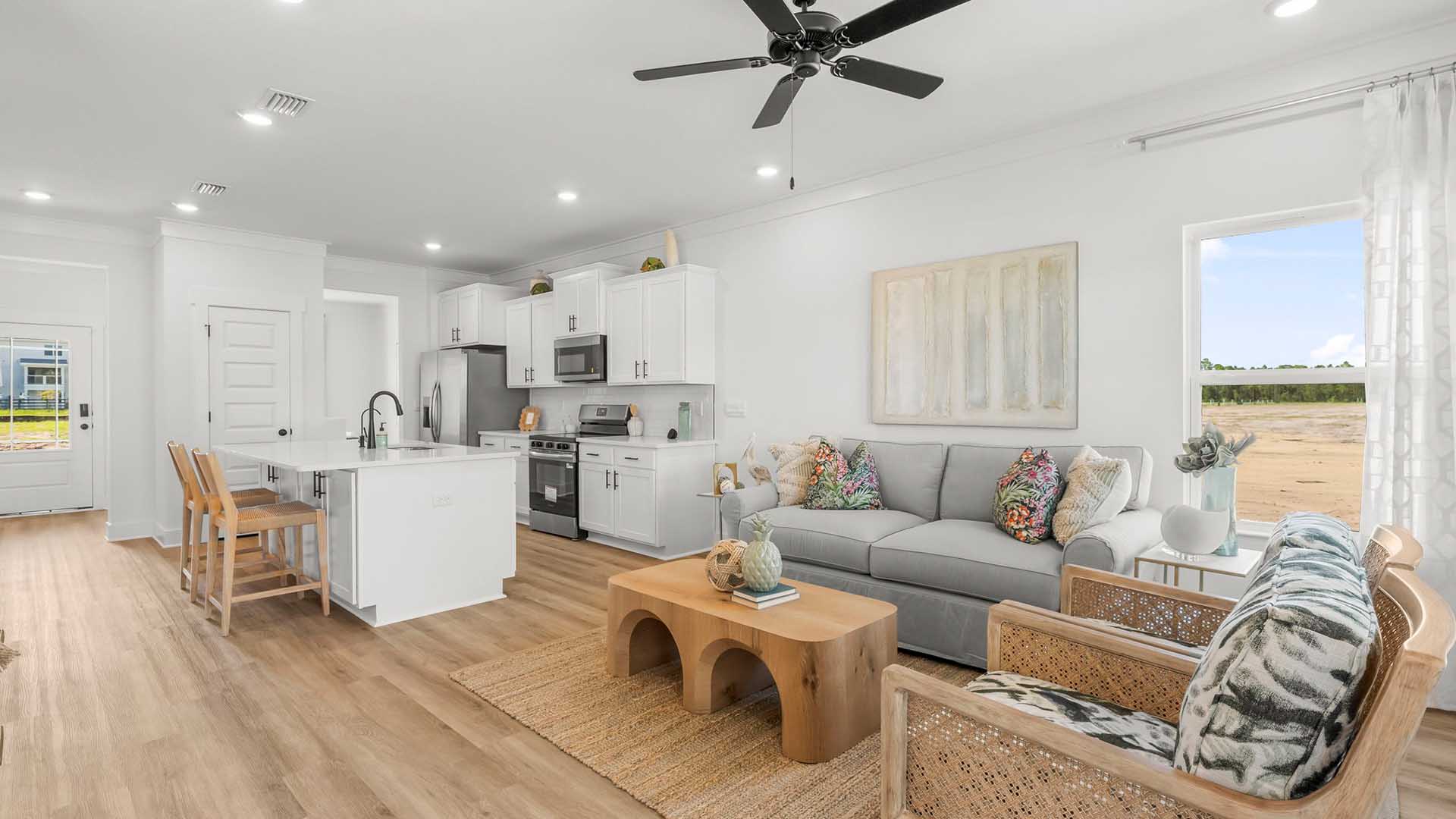 Open and spacious downstairs living area. This image shows the living space furnished with a living room set and dining area