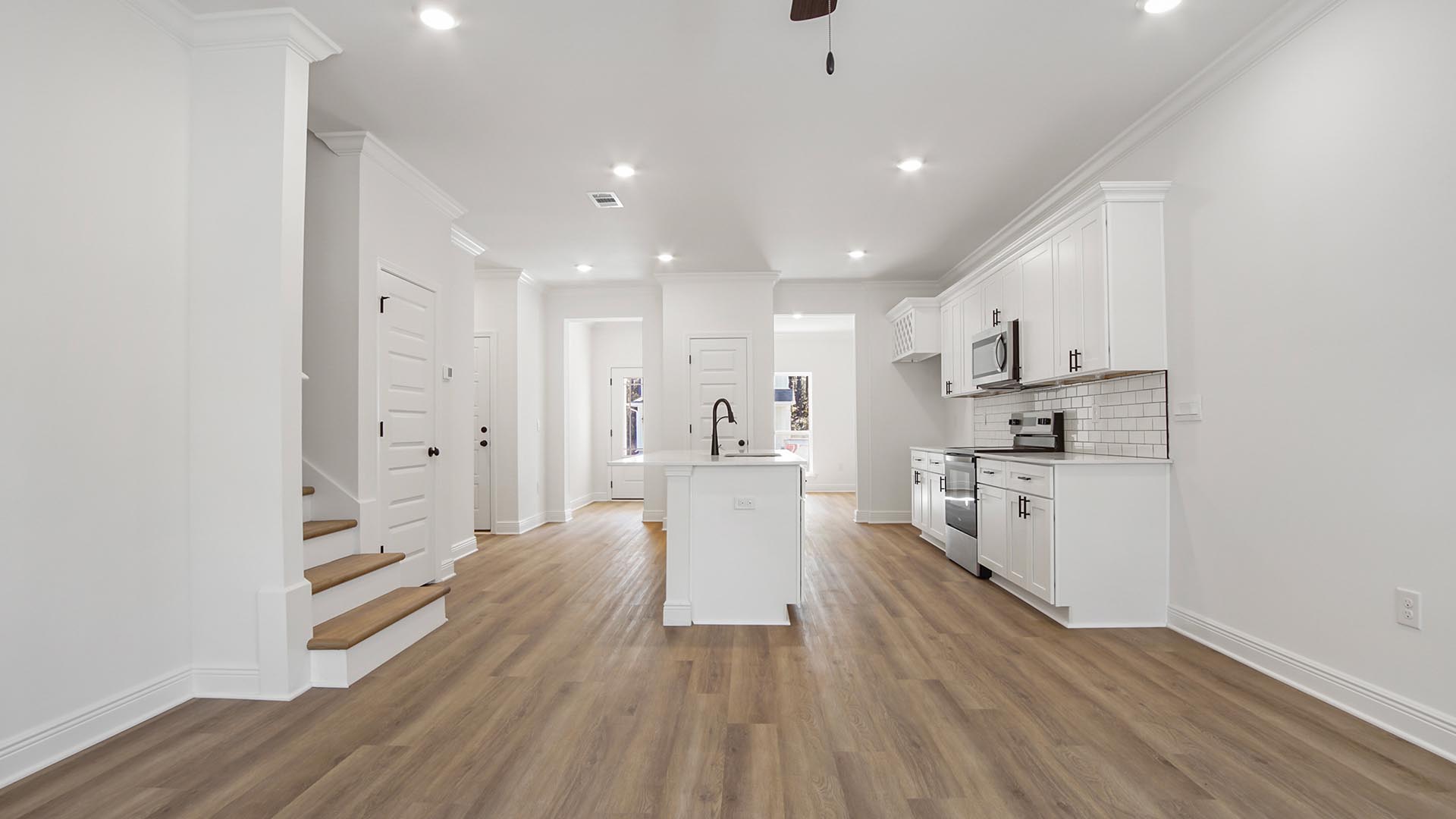 The main living area looking back to the kitchen and entry hall