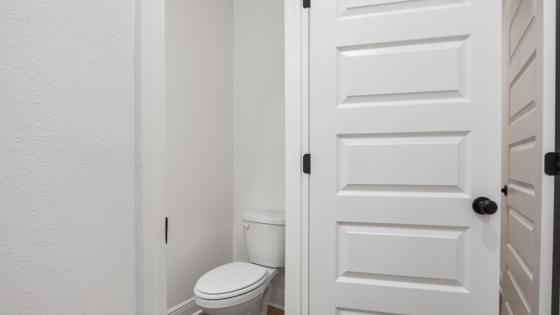 A primary bath is located off the foyer on the main level