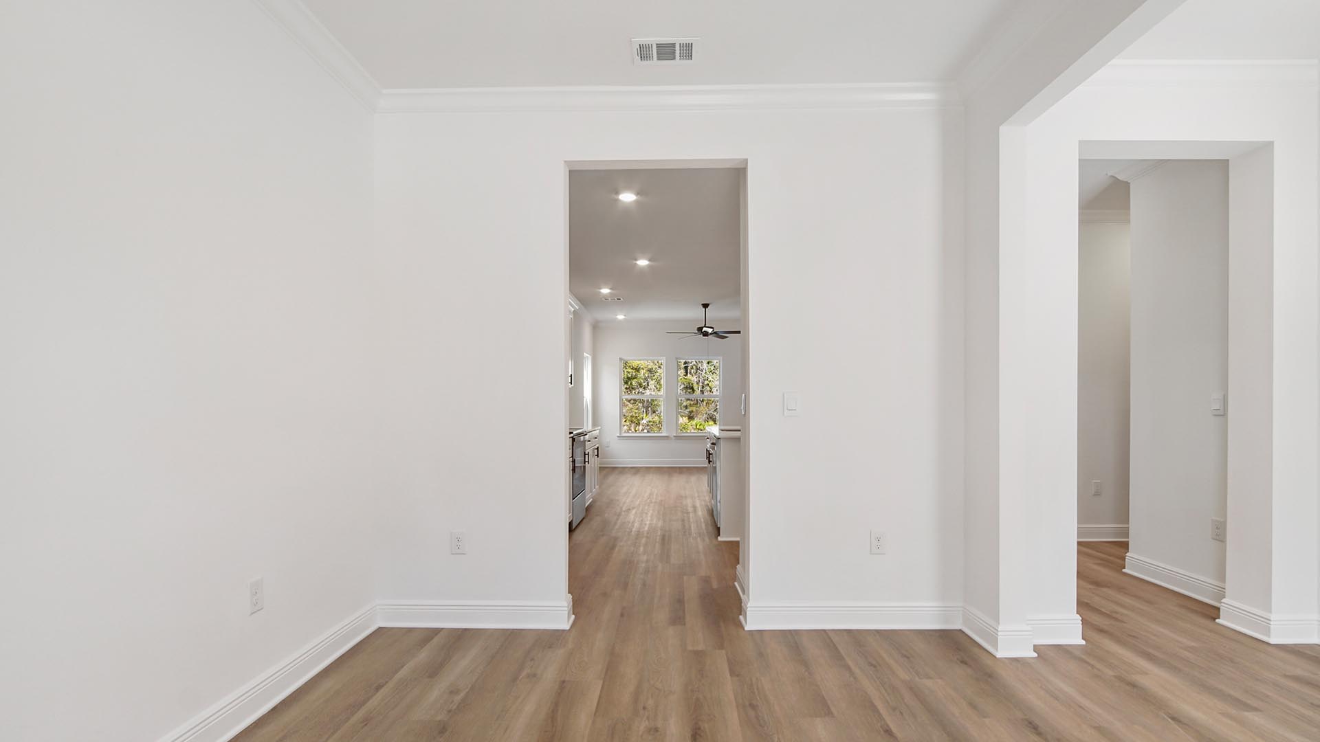 The dining room has a dedicated hall leading to the kitchen
