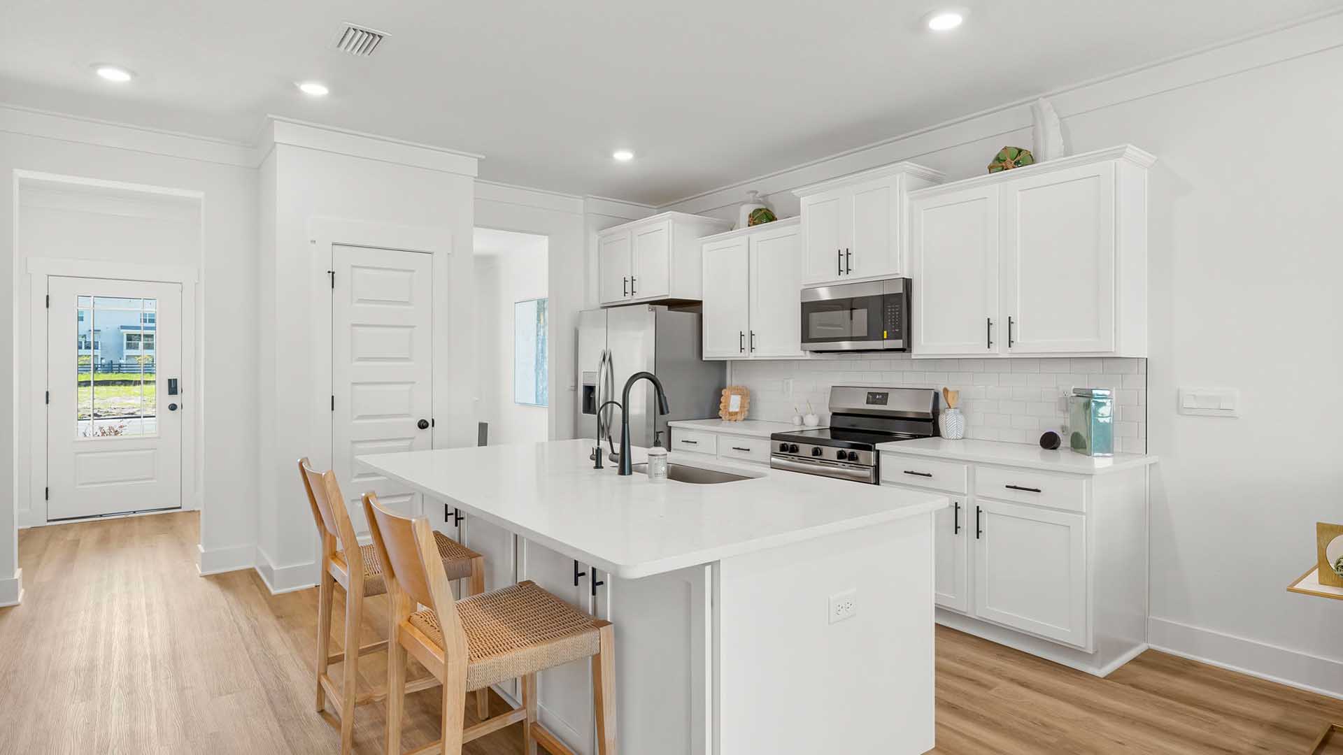 The center island in the kitchen has space for bar seating