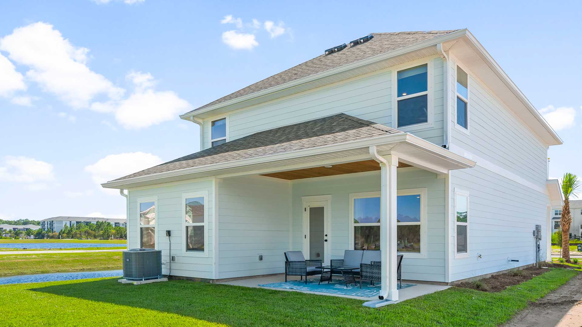 The covered patio has space for sitting area or outdoor dining space