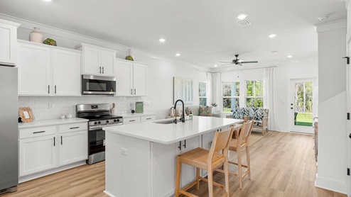 The kitchen in the Alabaster is adjacent to the living area