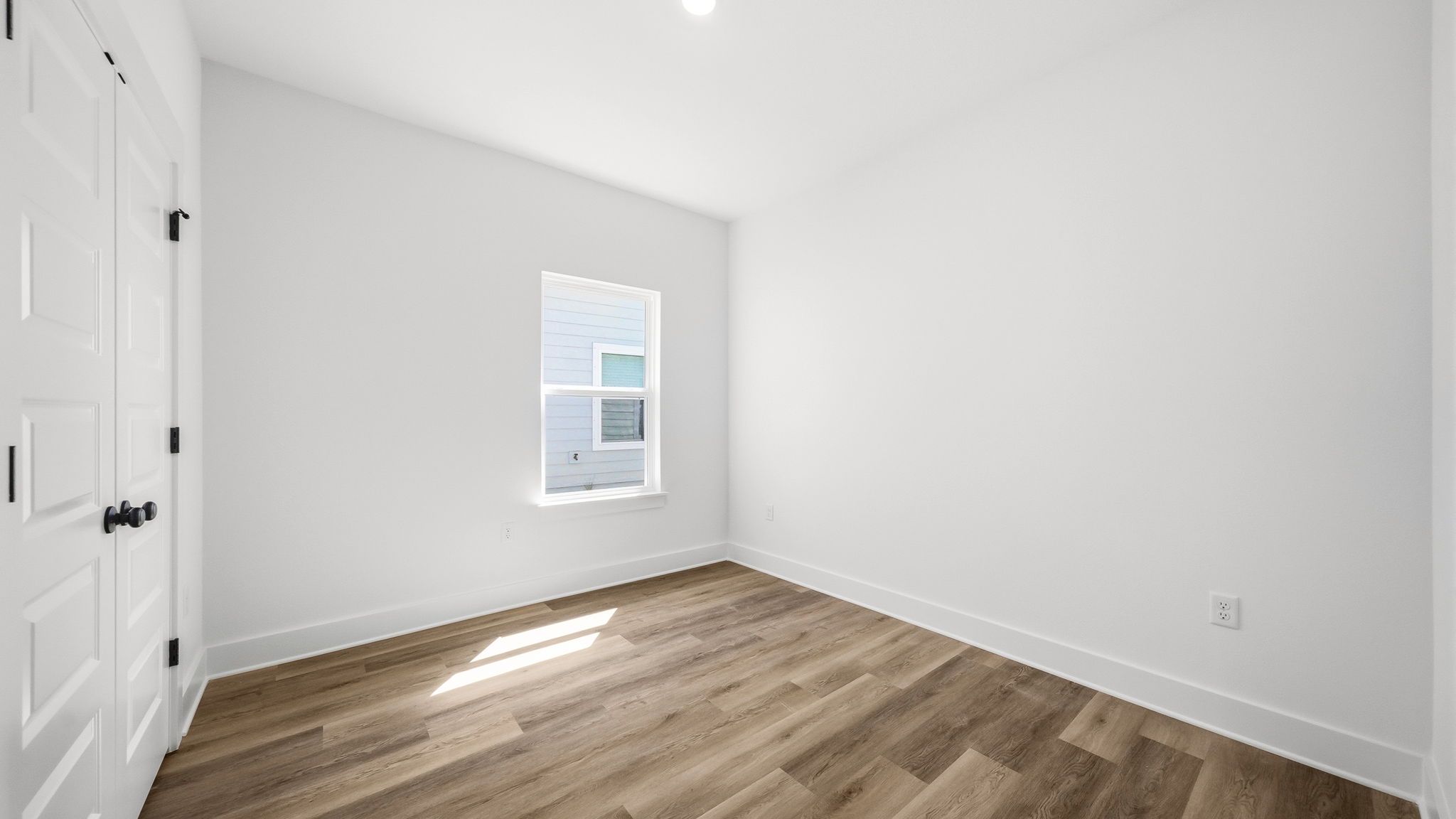 Guest bedroom two has EVP flooring